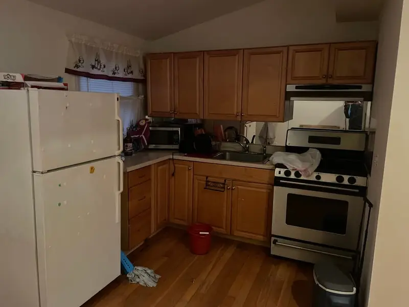 Kitchen with oak cabinets and white appliances, Centereach, NY